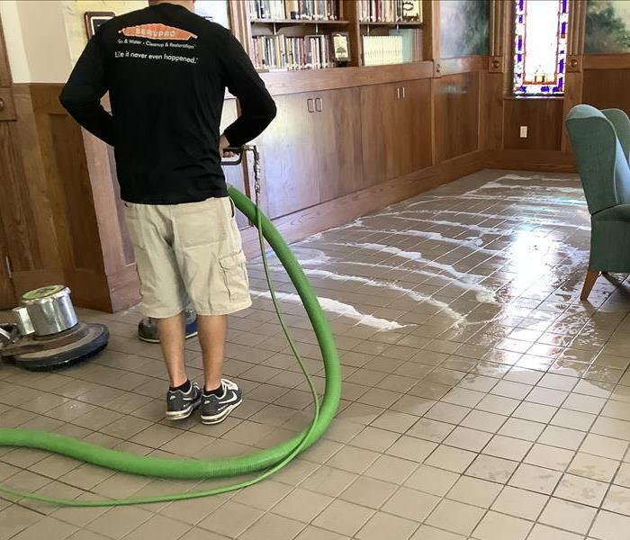 Technician cleaning the floor